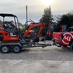 Kubota KX015 off to work