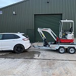 Takeuchi TB215 heading South